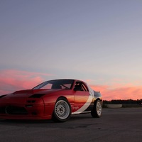 Red 1986 Mazda RX-7 on White Ford Crown Victoria
